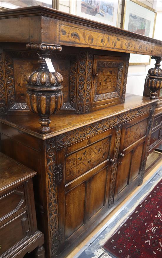 A 17th century design marquetry inlaid oak court cupboard W.160cm